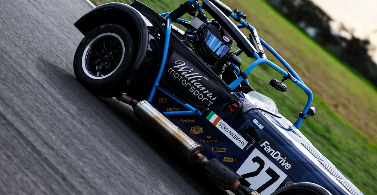 Caterham Seven 270R number 27, driven by Sean Murphy, leaning hard through a corner at Snetterton